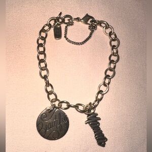 James Avery Charm Bracelet w/ 2 charms, one in which is retired.
